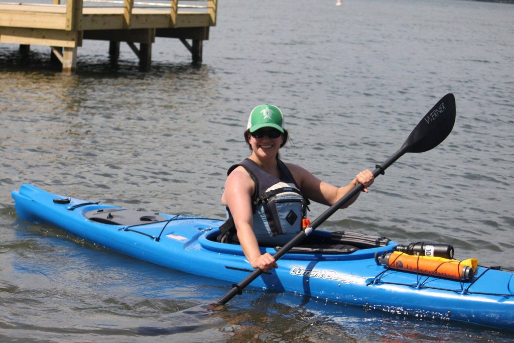 Find Hidden Gems of the Finger Lakes Region - The Long and Short of Paddling a woman in a kayak