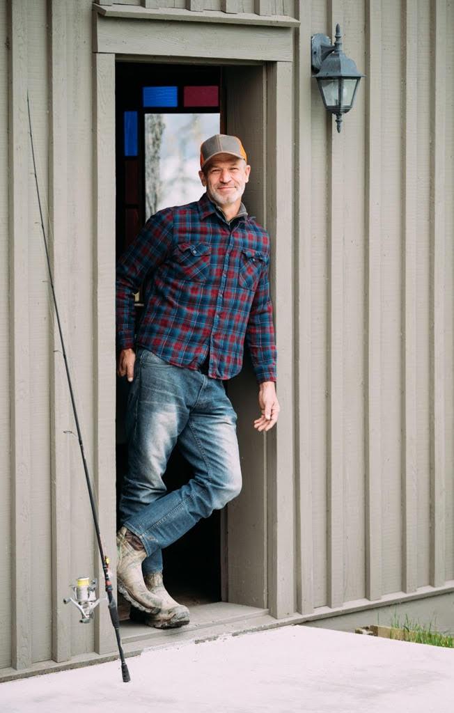 Find Hidden Gems of the Finger Lakes Region - Shine a Light a man standing in a doorway